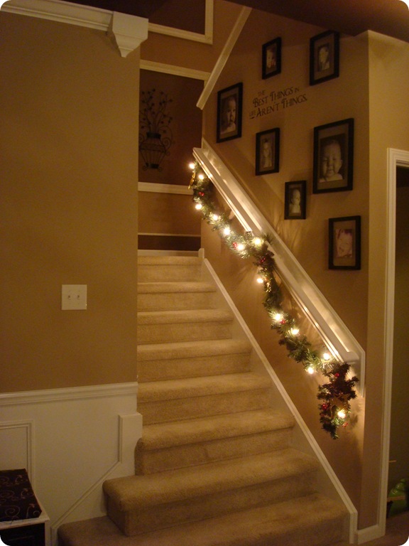 decorating the stair railings for Christmas